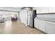 Open floor plan offers view of kitchen, dining, and living spaces at 9175 Cole Dr, Arvada, CO 80004