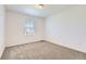 Comfortable bedroom with a neutral carpet and a window for natural light at 16686 E 110Th Ave, Commerce City, CO 80022