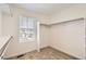 Walk-in closet with carpeted floor, window and a clothing rod for storage at 16686 E 110Th Ave, Commerce City, CO 80022