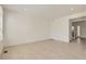Spacious living room featuring light wood floors and a doorway to the entry and staircase at 16686 E 110Th Ave, Commerce City, CO 80022