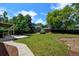 Spacious backyard featuring a shed, wooden deck, patio, and lush green lawn, perfect for outdoor activities at 6775 Coors Ct, Arvada, CO 80004