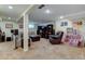 Large basement featuring a tv, a big sofa, a lounge chair, and a small playroom at 6775 Coors Ct, Arvada, CO 80004