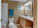 Well-lit bathroom features a single sink vanity and shower and tub combo at 6775 Coors Ct, Arvada, CO 80004