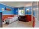 Bright bedroom with white trim, and blue and orange walls at 6775 Coors Ct, Arvada, CO 80004