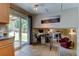 Eat-in kitchen with tile floor, stainless steel appliances, and sliding glass doors to the backyard at 6775 Coors Ct, Arvada, CO 80004