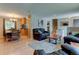 Open-concept living area showcasing the stairs and view into the dining area at 6775 Coors Ct, Arvada, CO 80004
