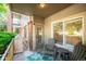 Cozy outdoor seating area on the balcony provides a tranquil escape with natural lighting at 2895 W Riverwalk Cir # 104, Littleton, CO 80123