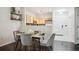 Chic dining area adjacent to the kitchen, perfect for hosting intimate gatherings at 2895 W Riverwalk Cir # 104, Littleton, CO 80123