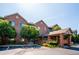 Attractive three-story brick building with well-maintained landscaping and covered entrance, offering accessible parking at 2895 W Riverwalk Cir # 104, Littleton, CO 80123