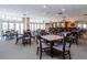 Spacious game room featuring tables, chairs and a bar area at 2895 W Riverwalk Cir # 104, Littleton, CO 80123