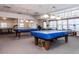 Game room with two pool tables and a ping pong table at 2895 W Riverwalk Cir # 104, Littleton, CO 80123