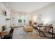 Cozy living room featuring hardwood floors, natural light, and a comfortable seating area at 2895 W Riverwalk Cir # 104, Littleton, CO 80123