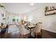 Sunlit living room and dining area offering a blend of comfort and style at 2895 W Riverwalk Cir # 104, Littleton, CO 80123