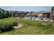 View of community pool area featuring pool, lounge chairs, and tables at 2895 W Riverwalk Cir # 104, Littleton, CO 80123