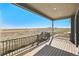 Expansive back deck overlooking a large lot with views of the surrounding landscape at 13690 Emerald Lake St, Parker, CO 80138