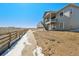 Rear elevation showcasing spacious backyard, deck and expansive views at 13690 Emerald Lake St, Parker, CO 80138