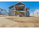 Rear elevation with a two story deck and walk out basement on a expansive lot at 13690 Emerald Lake St, Parker, CO 80138