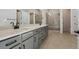 Spacious bathroom featuring dual vanity with modern fixtures and walk-in shower at 13690 Emerald Lake St, Parker, CO 80138