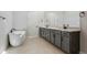 Primary bathroom featuring modern vanity with dual sinks, and soaking tub at 13690 Emerald Lake St, Parker, CO 80138