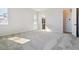 Bright bedroom with neutral carpet, white walls, and access to bathroom at 13690 Emerald Lake St, Parker, CO 80138