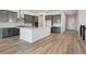 Kitchen featuring a center island, stainless steel appliances, gray cabinets, and hardwood floors at 13690 Emerald Lake St, Parker, CO 80138