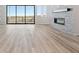 Bright living room featuring a modern fireplace and sliding glass doors at 13690 Emerald Lake St, Parker, CO 80138