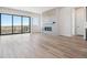 Bright living room featuring a modern fireplace, sliding glass doors, and scenic views at 13690 Emerald Lake St, Parker, CO 80138