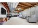 Spacious unfinished basement ready for customization, featuring exposed ceilings, carpet, and ample room at 9756 Quay Loop, Broomfield, CO 80021