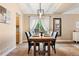 Elegant dining room with a wooden table and stylish lighting fixture at 9756 Quay Loop, Broomfield, CO 80021