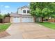 Charming two-story home with a three-car garage and a spacious driveway at 9756 Quay Loop, Broomfield, CO 80021