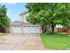Lovely two-story home featuring a well-manicured lawn and charming curb appeal at 9756 Quay Loop, Broomfield, CO 80021