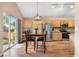 Open kitchen features stainless steel appliances, granite countertops, and a breakfast nook with backyard access at 9756 Quay Loop, Broomfield, CO 80021