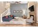 Cozy living room with a brick fireplace and comfortable seating area at 9756 Quay Loop, Broomfield, CO 80021