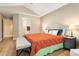 Spacious main bedroom boasts a comfortable bed, vaulted ceilings, and bedside tables with lamps at 9756 Quay Loop, Broomfield, CO 80021
