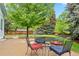 Cozy patio with outdoor dining set, surrounded by lush greenery, ideal for relaxing and entertaining guests at 9756 Quay Loop, Broomfield, CO 80021