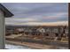 A panoramic street view capturing a neighborhood with mountain views in the distance beneath a cloudy sky at 630 E Hinsdale Ave, Littleton, CO 80122
