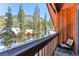 Inviting balcony with rustic wood siding provides picturesque mountain views and fresh air at 960 Whispering Pines Ln, Breckenridge, CO 80424