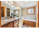 Well-lit bathroom featuring double vanity, granite counters, a soaking tub, and a tiled shower at 960 Whispering Pines Ln, Breckenridge, CO 80424