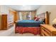 Comfortable bedroom features wood furniture, window with natural light, and cozy decor at 960 Whispering Pines Ln, Breckenridge, CO 80424