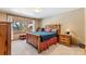 Comfortable bedroom features wood furniture, window with natural light, and cozy decor at 960 Whispering Pines Ln, Breckenridge, CO 80424