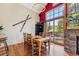 Dining area with wooden table set, ski decor, and sliding doors to outdoor deck with seating at 960 Whispering Pines Ln, Breckenridge, CO 80424