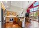 Open kitchen area with a breakfast bar, stainless steel appliances, and a dining area at 960 Whispering Pines Ln, Breckenridge, CO 80424