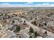A scenic aerial view of the neighborhood showcasing its layout and surrounding landscape at 19411 E Milan Cir, Aurora, CO 80013