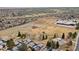 Expansive aerial view of the neighborhood with a park, baseball field, and tennis court at 19411 E Milan Cir, Aurora, CO 80013