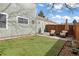A charming backyard with green grass and patio furniture, perfect for relaxing outdoors at 19411 E Milan Cir, Aurora, CO 80013