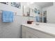 Bathroom featuring a vanity with a single sink and a large mirror at 19411 E Milan Cir, Aurora, CO 80013