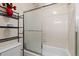 Full bathroom with tub and shower combination and sliding glass door at 19411 E Milan Cir, Aurora, CO 80013