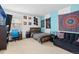 Bedroom with queen sized bed, comfortable seating, and desk at 19411 E Milan Cir, Aurora, CO 80013