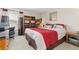Cozy bedroom featuring a comfortable bed and built-in bookshelves at 19411 E Milan Cir, Aurora, CO 80013
