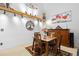 Tastefully decorated dining room with a decorative wall and complementary wooden furniture at 19411 E Milan Cir, Aurora, CO 80013